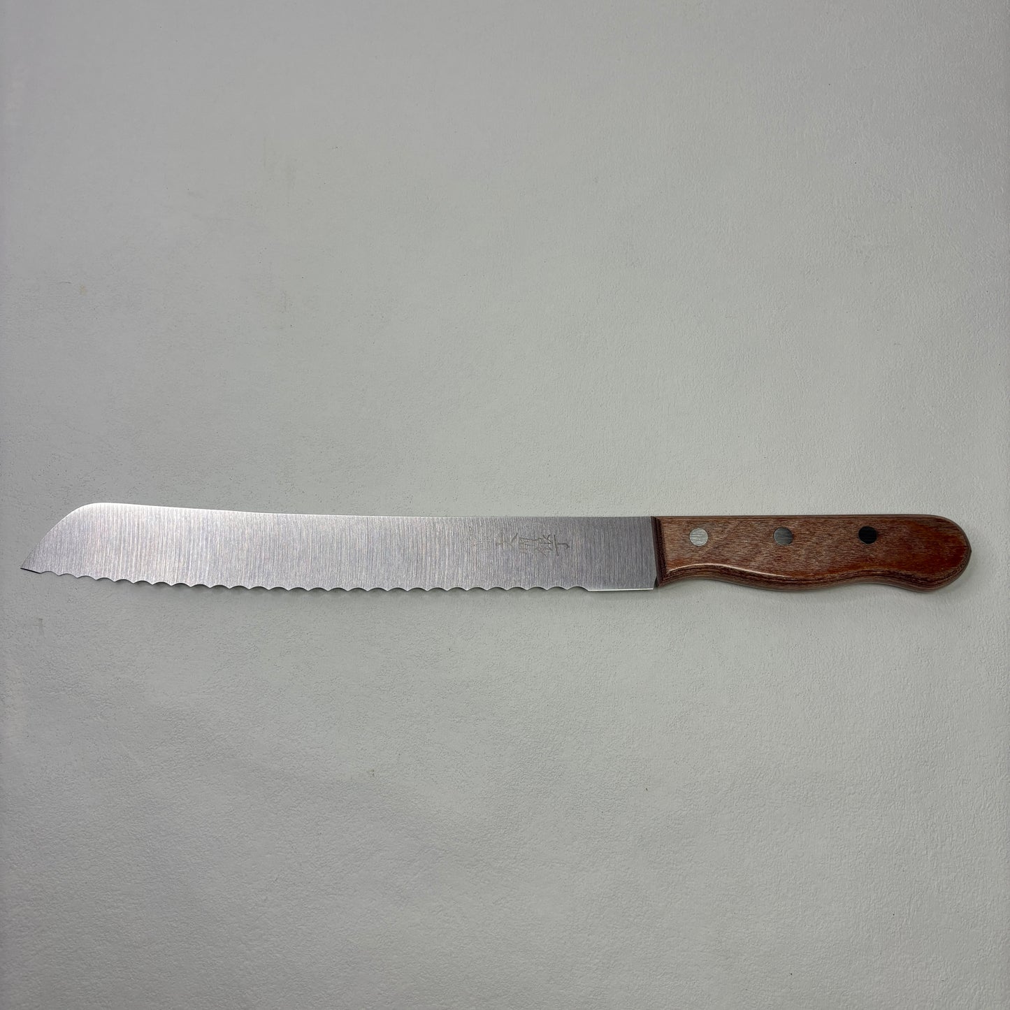 Brand new Japanese Bunmei Yoshikin Bread Knife. 260mm (Stainless Steel) with original package